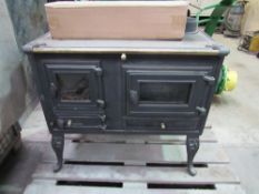 Free standing wood burning stove with oven and two hot plates