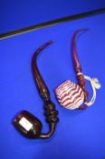 Two Cranberry Glass Pipes