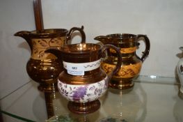 Three Copper Lustre Jugs