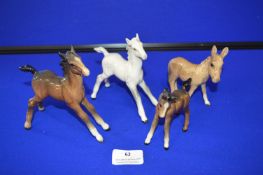 Three Beswick Foals and a Donkey