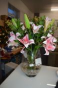 *Artificial Lilies in a Glass Vase
