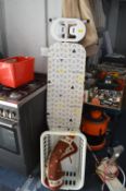 Ironing Board, Laundry Basket and a Rug