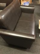 * A Brown Faux Leather Two Seat Sofa