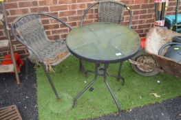 Glass Topped Table and Two Chairs