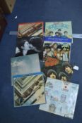 Eight Beetles and John Lennon LPs; Rubber Soul, et