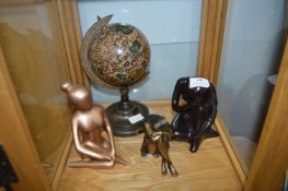 Three Seated Figures and a Globe