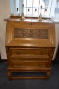 Carved Oak Automatic Bureau with Grape & Vine Deco