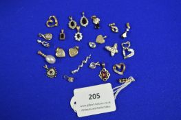 Twenty-Four 9k Gold Pendants ~19.7 total