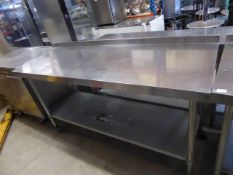 * Vogue S/S prep brench with upstand to rear and undershelf on castors. 1500w x 700d x 1050h