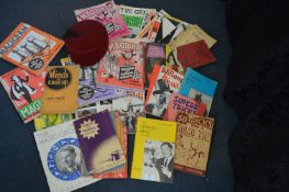 Vintage Magician Books and magazines, plus a Fez