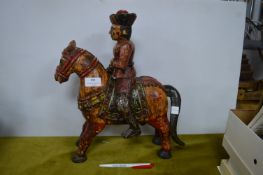 Wooden Sculpture of a Man on a Horse