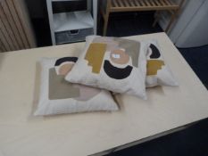 *Three Patterned Scatter Cushions