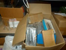 Measuring Glass, Box of Forceps, and a Box of Scis