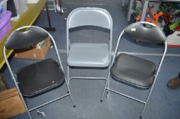 Three Folding Metal Chairs