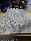 * small white milk jugs x approx. 50