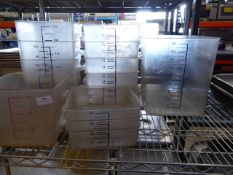 * selection of heavy duty storage/measuring tubs x approx. 12