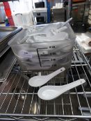 * large quantity of white serving spoons