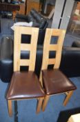 Two Leather Back Dining Chairs