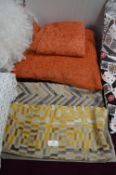 Three Cushion Covers and a Terracotta Cushion