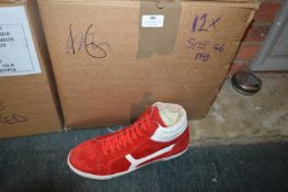 Twelve Pairs of Size: 46 Red Trainers