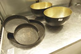 * selection of trays and bowls - metal with dimpled design