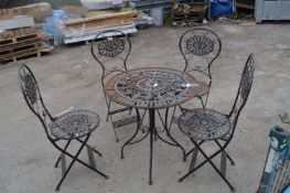 *Cast Iron Garden Table and Four Chairs