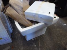 * closed couple toilet and cistern