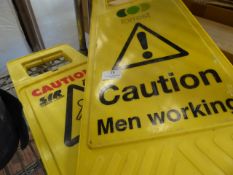 * pair of yellow caution signs