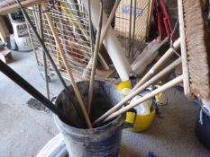 * bin and contents - brushes, rake, hoe