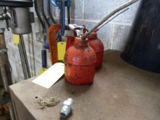 *Two Red Oil Cans