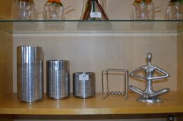 Three Vera Wang Canisters A Newton's Cradle and a Buddha