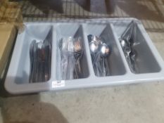* grey tray with cutlery
