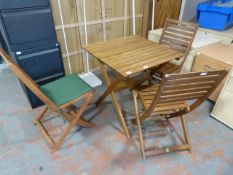 *Small Garden Table on Three Chairs