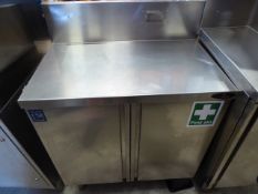 * S/S preptop bench with under cupboard and splash back to rear. 800w x 500d x 1100h