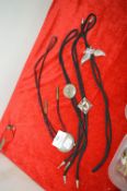 String Ties Including Silver Dollar
