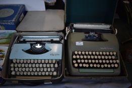 Two Vintage Typewriters by Smith Corona and Olympi