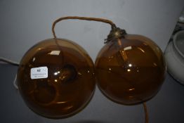 Two Brown Glass Pendant Lamps