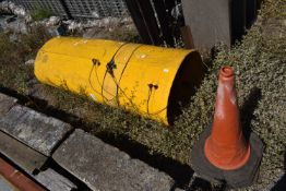 *Three Yellow Rubbish Chutes and Two Traffic Cones