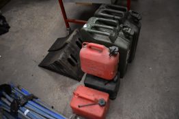 *Two Jerry Cans, Three Petrol Cans, and Two Vehicl