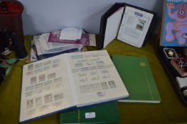 Four Stamp Albums plus First Day Covers etc.