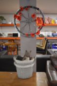 *Decorative Bike Wheel with Artificial Poppies, Two Woven Baskets and a Weight Squirrel Doorstop