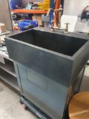 * statement sink with brass tap, under cupboard with water tank and bin chute. Ideal for beauty