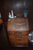 *Fall Front Reproduction Mahogany Bureau with Fitted Interior Containing Various Hairdressers Gowns,