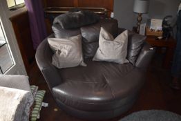 *Circular Swivel Grey Leather Chair with Throw and Two Scatter Cushions