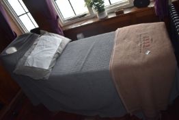 *Multipositional Electrically Operated Massage Bed with Step Stool, Throws, Pillow, and Towel