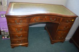 Small Serpentine Front Desk with Tooled Leather In