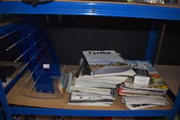 *Quantity of Cycling Magazines and a Countertop Tifosi Swank Series Display Unit