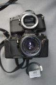 Two Pentax MV1 35mm Cameras