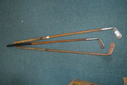 Three Vintage Golf Clubs