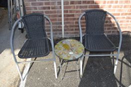 Two Patio Chairs and a Peacock Table